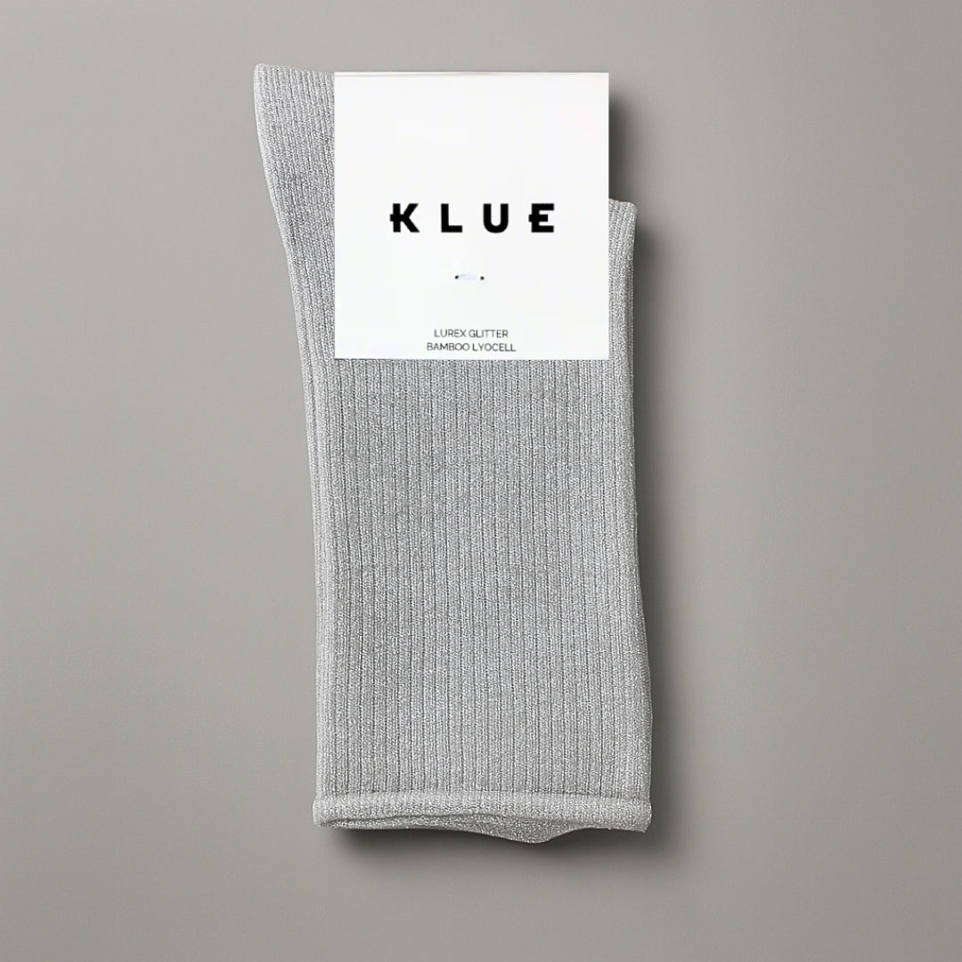 Gray sock with KLUE label on a gray background