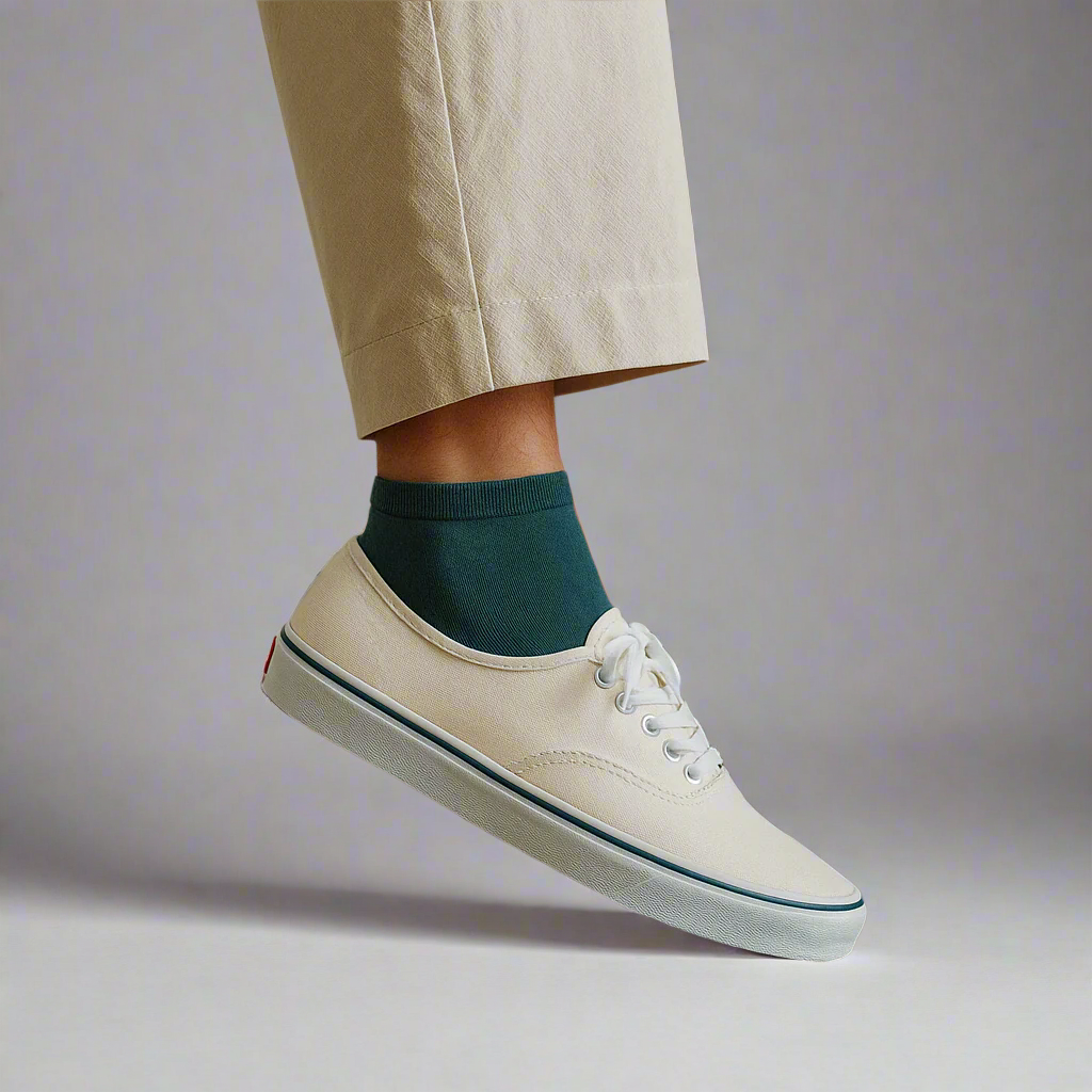 Blue ankle socks worn with sneakers on minimalist set