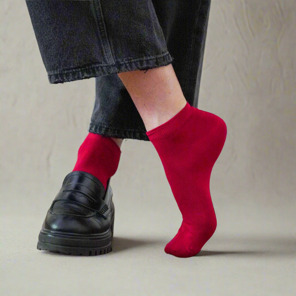Women's red lyocell ankle socks worn with white sneakers and cropped pants – Klue sustainable fashion photo.